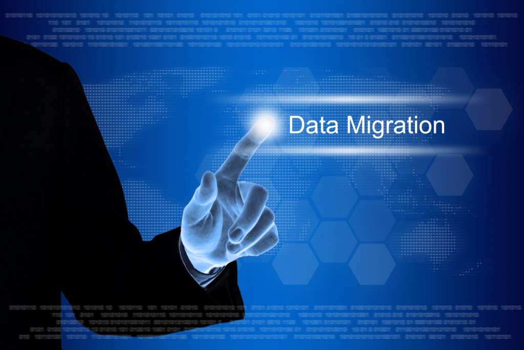 business hand clicking data migration button on touch screen